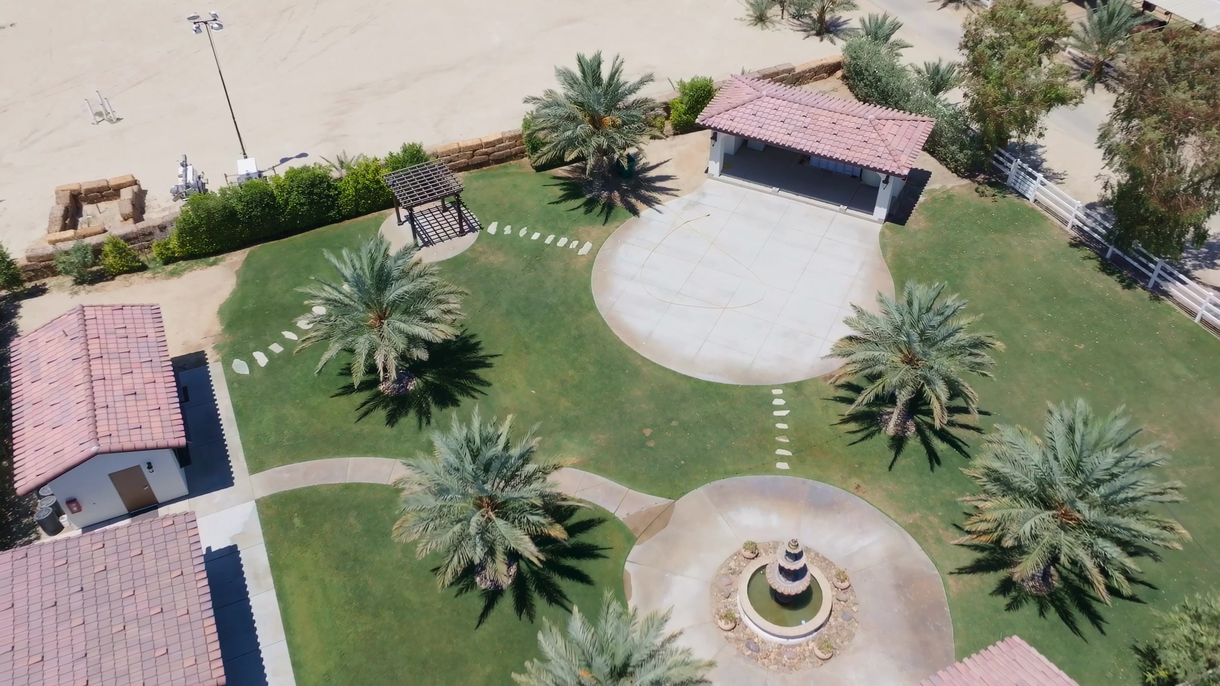 Top-down aerial of Rancho Escondido fountain courtyard, ceremony aisle, and dance floor.
