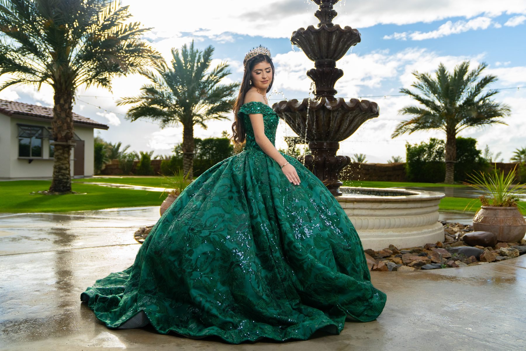Quinceañera in emerald sequined ball gown at Rancho Escondido in Indio, California.