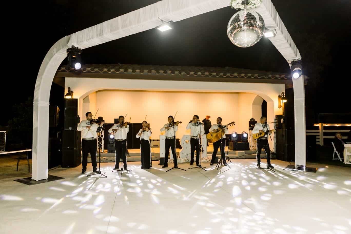 Mariachi band performing under the pergola during a wedding reception at Rancho Escondido.